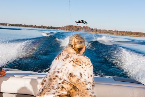 Jackie watches Trevor Hansen, 25,&nbsp; a professional wakeboarder, from a friend&rsquo;s boat, Windermere, Florida, 2010, Archival Pigment Print