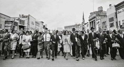 Dr. Martin Luther King Jr., his wife, Coretta, Rosa Parks, and other activists march for voting rights, 1965