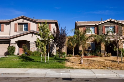 The property line between an abandoned home and its occupied neighbor in the Rosetta Canyon development, Lake Elsinore, California, 2008, Archival Pigment Print