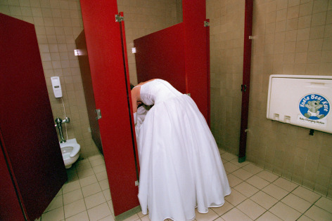 One debutante helps another to pee in the ladies&#039; room at the Cotton Ball, Chattanooga, Tennessee., Archival Pigment Print