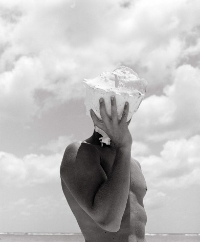 Man Holding Shell, Australia, 1986, 20 x 16 Inches, Silver Gelatin Photograph, Edition of 25