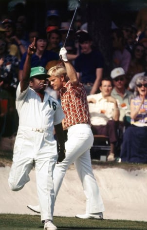 Jack Nicklaus with caddie Willie Peterson celebrate after making a birdie putt on the 16th green during Round 1, Masters Tournament at Augusta National GC, 1972, Color Photograph