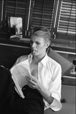 David Bowie reading his script (b&amp;amp;w), The Man Who Fell to Earth,&nbsp;Los Angeles,&nbsp;1974, Silver Gelatin Photograph