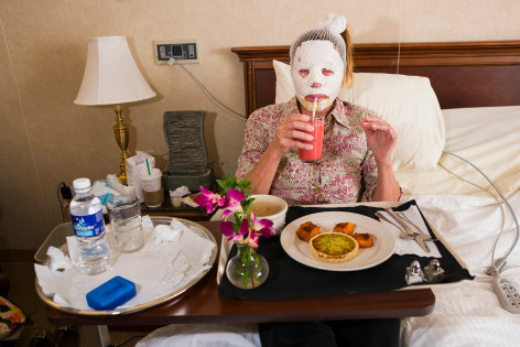 Dr. Steven Teitelbaum&rsquo;s forty-nine-year-old patient, who is recovering from a full-face laser resurfacing and an upper eye lift, eats lunch in a private room at Serenity, a luxury aftercare facility that offers private chefs, spa treatments, and twenty-four-hour nursing, Santa Monica, California, 2006&nbsp;&nbsp;&nbsp;&nbsp;, 20 x 30 inch - Archival Pigment Print - Ed. of 5