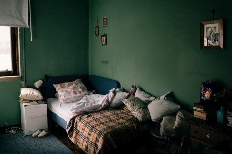 The bedroom of the elderly lady cared for by Ana Maria Jeremias. Lisbon, Portugal, 2024