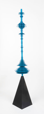 a sculpture by Elizabeth Turk of blue aluminum discs layered and arranged to resemble a sound wave and a modernist abstraction