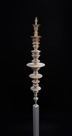 a sculpture by Elizabeth Turk of 3D-printed discs layered and arranged to resemble a sound wave and a modernist abstraction