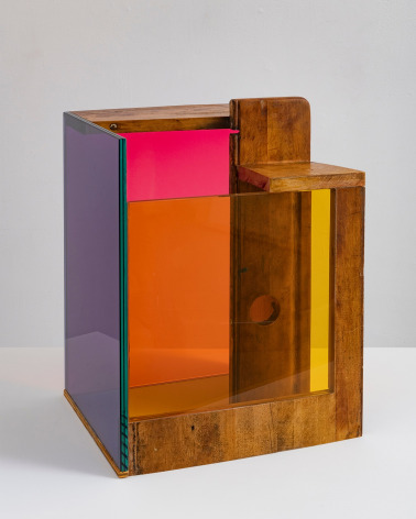 a sculpture by Sarah Braman of a cabinet draw fused with multi-colored glass panels