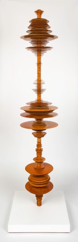 a sculpture by Elizabeth Turk of wood discs layered and arranged to resemble a sound wave and a modernist abstraction