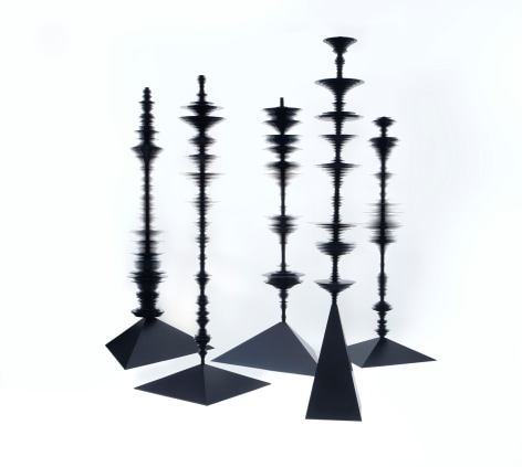 sculptures by Elizabeth Turk of black aluminum discs layered and arranged to resemble Modernist abstractions and a sound waves