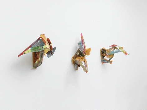 Three multicolored wall sculptures