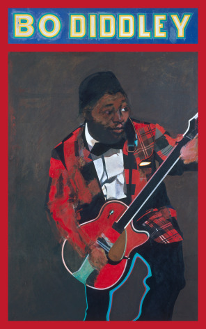 Man playing guitar wearing red plaid blazer, with &quot;Bo Diddley&quot; written across top of board