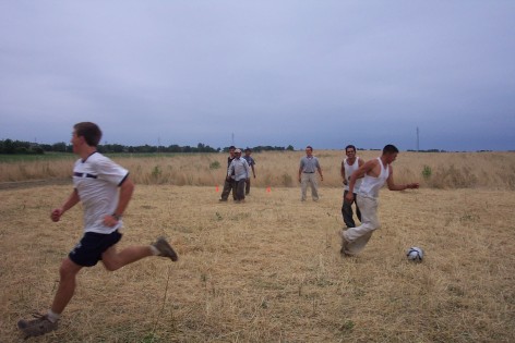 Field crew playing soccer at lunch time