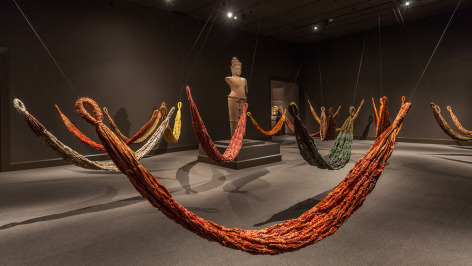 Pinaree Sanpitak, Hanging by a Thread, 2012, tie-Hammocks with Paa-Lai, traditional Thai printed cotton fabric, variable dimensions, Collection Los Angeles County Museum of Art, California. Installation view at Los Angeles County Museum of Art. Photo: Peter Brenner, Museum Associates / LACMA.