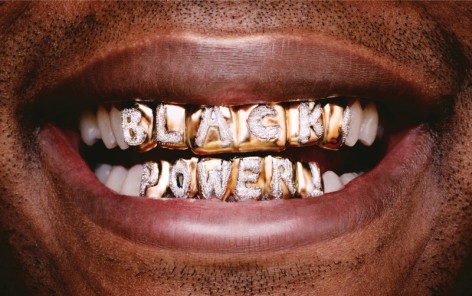 Hank Willis Thomas  Black Power, 2005  lightjet print  25h x 40w in 63.50h x 101.60w cm  Edition 4/5  hwt_001, photograph of a black, male smiling with a diamond and gold grill that reads &quot;black power&quot;