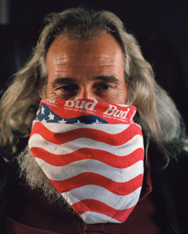 Person with Budweiser bandana over mouth, by McNair Evans