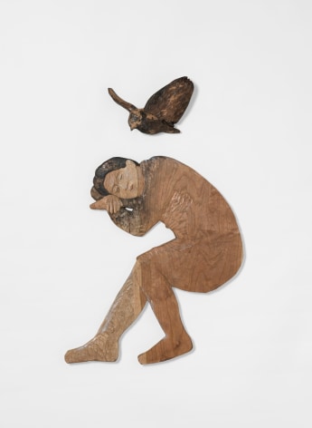 Wood sculpture of sleeping figure with bird, by Sachiko Akiyama