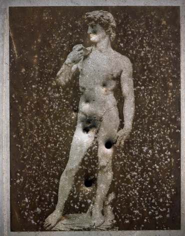 Photograph of a shot up tin printing plate of the sculpture David