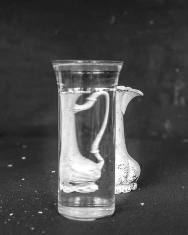James Henkel  Water Pitcher, 2019  Archival Pigment Print  14h x 11w in 35.56h x 27.94w cm  Out of 30  JHe_046  $ 250.00, a water pitcher as seen through a cup of water