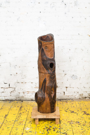 Gerald van de Wiele  Hollow Voices, 1998  Hand Carved Black Walnut  37 1/2h in, hand carved vertical sculpture of tree trunks