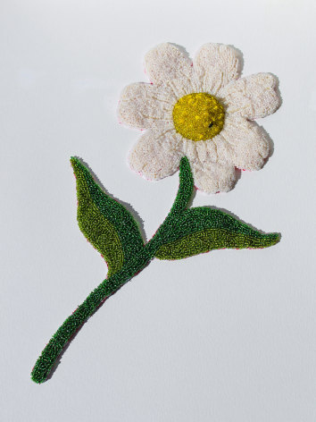 Beaded soft sculpture of a white, yellow and green daisy. A small fly sits in the center