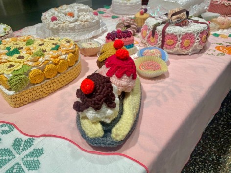 Installation of dessert table made from crochet's objects