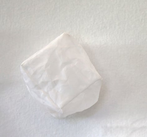 Kathryn Clark  Wunderkammer 2, 2019  Machine stitched cotton organdy  3 1/2h x 3 1/2w x 4d in -cube shaped white cotton wall sculpture
