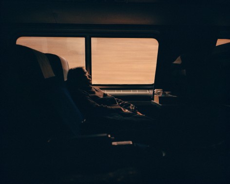 Silhouette of person on train, by McNair Evans