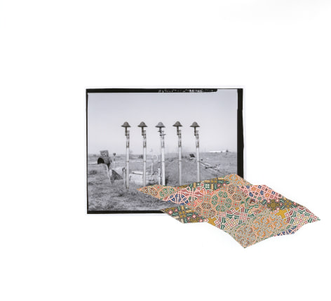 Kirsten Stolle  Escape Hatch, from the series &quot;Disarm:, 2016  collage on archival pigment print  15h x 16 1/2w in  Unique, gelatin silver print of a military base with a colorful collage element.