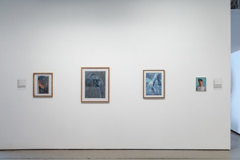 Installation view of three prints by Daniel Simone and a small painting by Marcus Dunn
