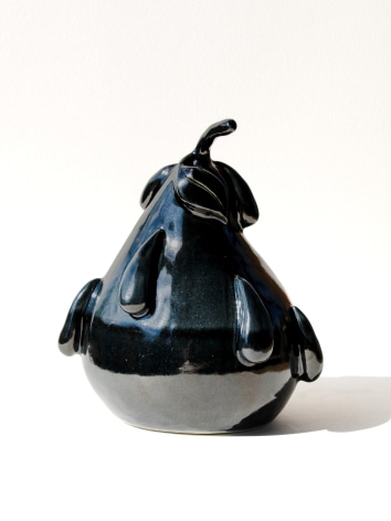 black ceramic sculpture of a pear