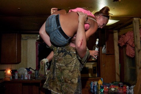 Stacy Kranitz  West Columbia, West Virginia, 2013  Archival Pigment Print  16 x 24 inches, Edition of 7  27 x 40 inches, Edition of 3, Man lifting up woman in jeans, West Viginia