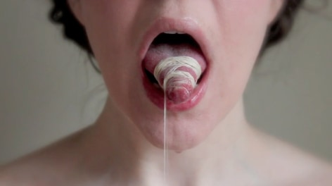 April Dauscha  Custody of the Tongue, 2013  Looped Video and Player - Video of tongue Binding, Veiling and Consumption