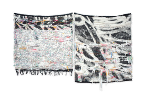 abstract fiber diptych with a black and white graffiti motif. The piece also have delicate floral patterns and loose hanging strips of fabric