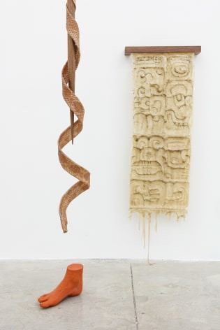 Group Show with Commonwealth and Council: Clarissa Tossin, ucham K'awiil (2018). Silicone, walnut, faux serpent skin, quetzal faux feather (dyed rooster feather), faux terracotta (dyed plaster), dimensions variable