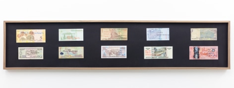 Group Show with Commonwealth and Council: Carolina Caycedo, Vocabulary and Infrastructure/Vocabulario e infrasstructura (after The Distance Plan) (2017). Marker on 10 banknotes, frame, 10 x 47 x 1.5 inches (25.4 x 119.4 x 3.8 cm)