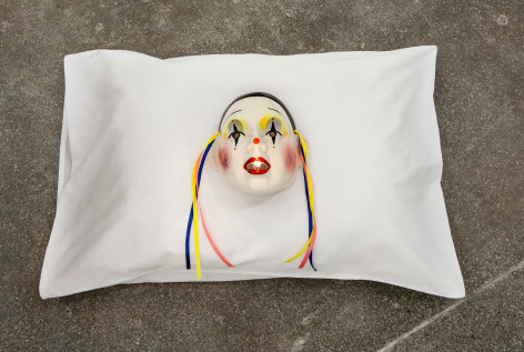 Jamie IsensteinFire in the Mouth, 2015Pillow, mask, oil lamp6 x 29 x 20 in (15.2 x 73.7 x 50.8 cm)&nbsp;