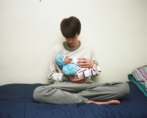 Alex Nelson, Owen feeding the fake baby, Maine, 2015