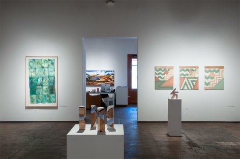 Installation shot of U.C.S.B. M.F.A. 20/20 Exhibition with pieces by Mary Heebner, R. Nelson Parrish, and Nathan Hayden with Phoebe Brunner in background