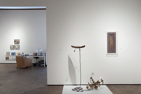 Installation photograph of JUXTAPOSED: The Art of Curation with works by Nathan Huff and Ron Robertson with works by Wosene Worke Kosrof and Harrison Gilman in background