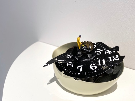 Liliana Porter, To Fix It [Man in Yellow], 2020. Broken table clock and figurine, 3 x 4 1/2 x 3 in. (7.6 x 11.4 x 7.6 cm.)