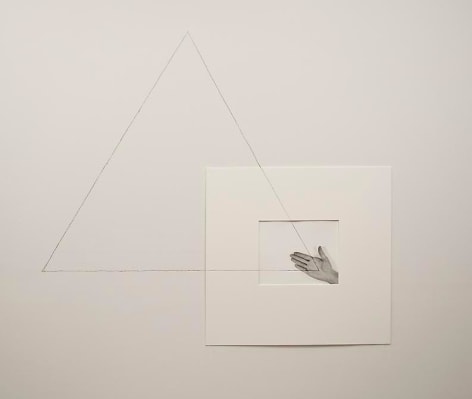 Liliana Porter, Untitled (triangle with one hand / right), 1973. Gelatin silver photograph with graphite pencil line, 14 in. x 11 in.