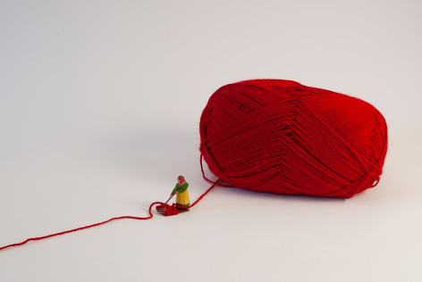 Liliana Porter, The Anarchist, 2024. Installation/Assemblage &ndash; Figure with red yarn, Dimensions variable.