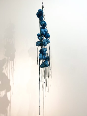 Sandra Monterroso,&nbsp;Puntos en resistencia azul.&nbsp;Edition. 7/13, 2019. Installation Indigo dyed yarn, loop, steel rope, 13 knots. 56 x 8 x 8 in. (142.2 x 20.3 x 20.3 cm.)