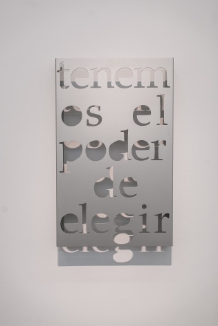 Marie Orensanz, Tenemos el poder de elegir, 2010. Hydro-cut Aluminum, 20 x 31 3/4 x 3 in.