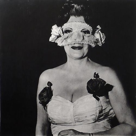 Diane Arbus Lady at a masked ball with two roses on her dress.  N.Y.C.  1967