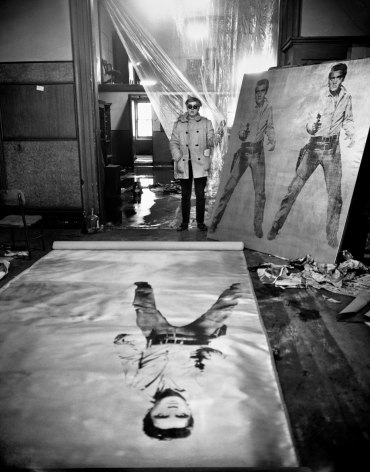 Evelyn Hofer, Andy Warhol (in his studio with Elvis Presley print), New York, 1963