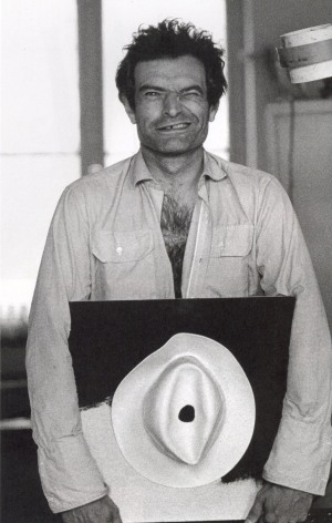 Marcel Broodthaers in his apartment with Chapeau blanc, Rue Van Elewyck, Brussels, ca. 1965