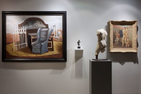 Installation view of Mnemosyne: de Chirico and Antiquity featuring two paintings and a Roman statue.  The paintings are from Giorgio de Chirico, Mobili Nella valle, 1927, Oil on canvas, 97 x 130 cm (38 x 51 &frac14; in.) Giorgio de Chirico, Scuola di gladiatori, 1928 c. Oil on canvas 55 x 44 cm. The Roman statues is anonymous, Torso of an ephebe, Roman, first half of the 1st Century A.D. Marble Height: 53.5 cm (21 inches).  Photography by Karen Fuchs. &copy;Helly Nahmad Gallery NY.
