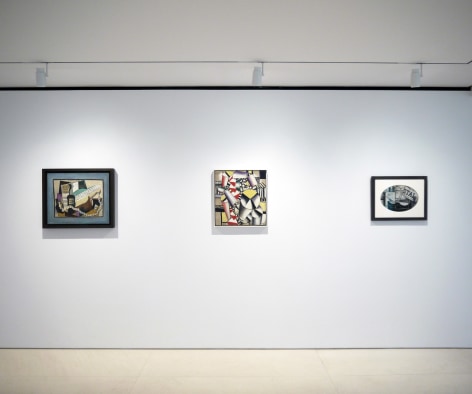 Installation view of The Climax of Cubism. Photography by Bianca Boragi. &copy;Helly Nahmad Gallery NY. This image features three paintings on a white wall, from, left to right, Pablo Picasso, Partition, Bouteille de Porto, Guitare, Cartes &agrave; Jouer (Music Partition, Bottle of Port, Guitar, Playing Cards) made in 1917 representing a still life composed of a guitar and a bottle of porto a news paper on a blue background. All these elements are represented in a cubist manner. The next painting is by fernand Leger and is called, Les Cylindres Color&eacute;s (The Colored Cylinders) it's a colorful and abstract composition representing a group of cylinders painted in purple, pink, yellow, white palette delineated with black lines. The last painting on the right is by Georges Braque, it is called, Guitare et Journal: STAL (recto); Femme &agrave; la Mandoline (verso) (Guitare and Journal), it is a black and white gouache, the shape of the painting is oval but it is framed in a rectangular frame. The composition is quite abstract and cubist, black lines intersect with curvy lines, we can see a piece of newspapers which letters read STAL and the word telephone.